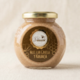frasco de vidrio con tapa dorada miel con canela y naranja dulce vuelo